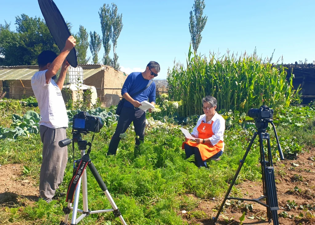 Video crew filming a commercial on a farm